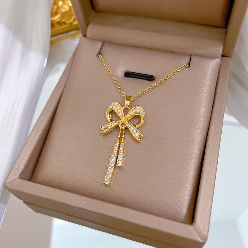 Exquisite and Fashionable Hollow Pearl Bow Tassel Necklace Earrings Set
